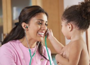 Nurse checking the baby's heartbeat