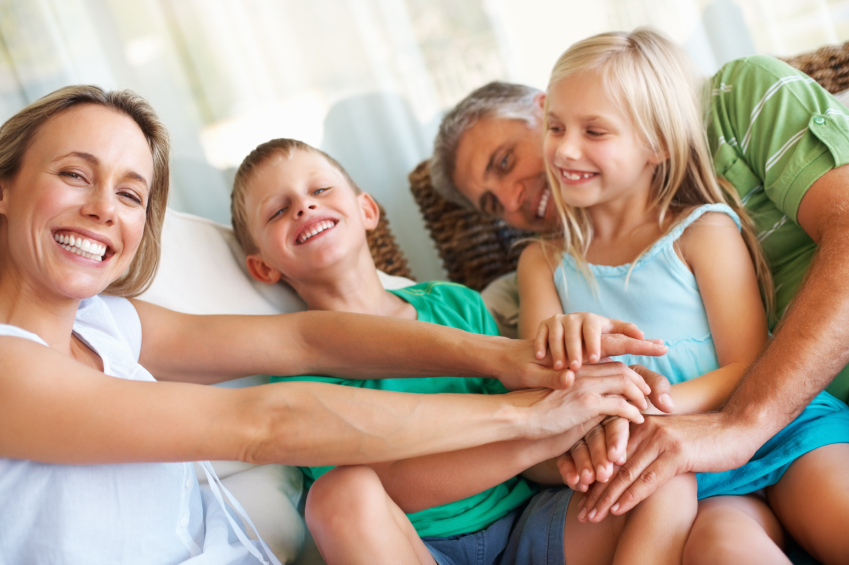 Caucasian Family smiling and sitting outside